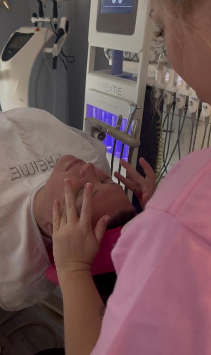 Woman getting traditional facial at Moore Smiles