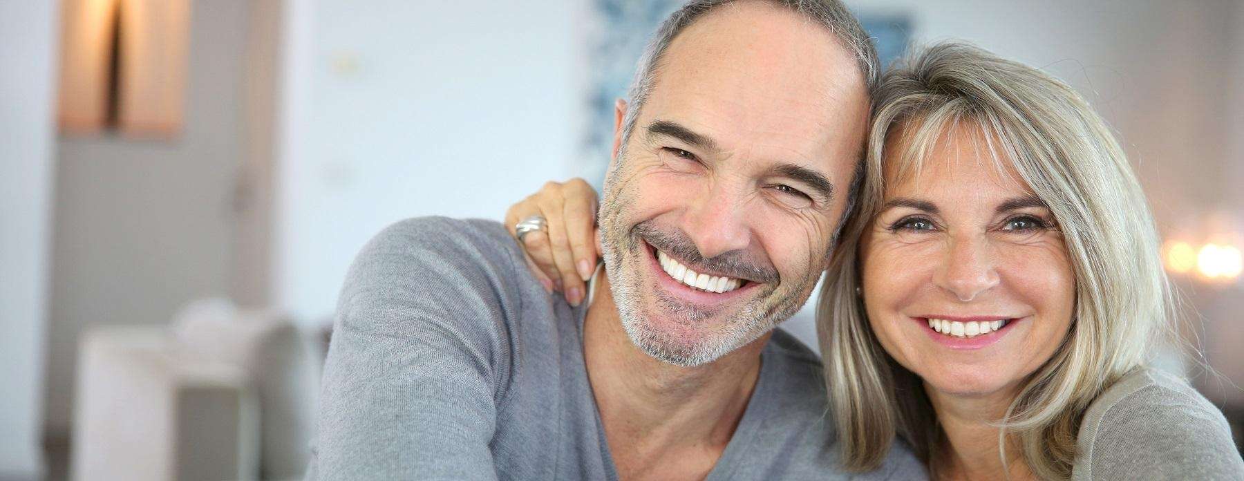 implant dentist near me | couple smiling