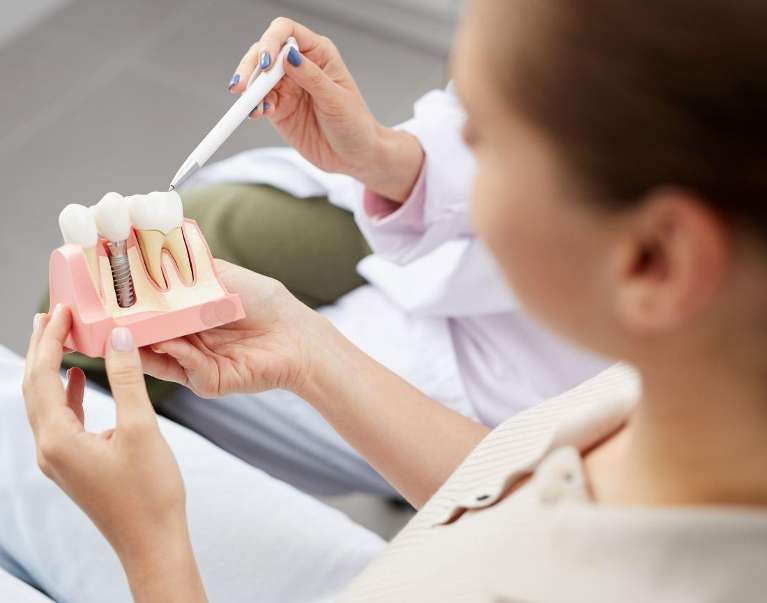 dental implants sweetwater | woman at consultation