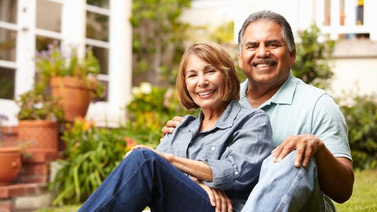 implant dentist near me | couple smiling