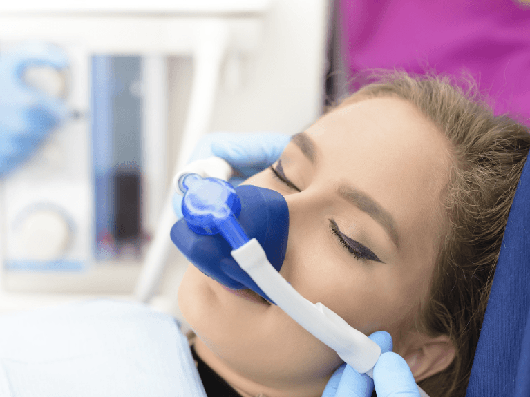 sedation dentistry sweetwater | patient receiving nitrous oxide